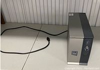 MGE Evolution 450 UPS unit from side and front showing power cord and branding.