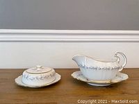 Round butter dish with lid, decorated with gray leaf pattern and gold gilt on white fine china