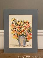 Full view of watercolor painting showing vibrant floral bouquet in tall blue vase with light blue matting.
