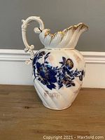 Full view of the antique Foley B & K chamber jug showing shape, handle, and scalloped rim with gold accents.