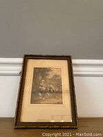 Framed antique colored print by George Baxter showing the full framed artwork upright against a wall.