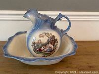 Water pitcher seated inside the matching basin showing the complete set colors and designs