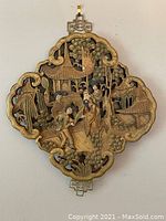 Full view of the carved wood wall art featuring 4 figures, pavilion, trees, and ornate border