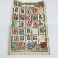 Album page labeled Europe, Part II with various vintage stamps from Hungary, Greece, and other European countries as early as 1871.