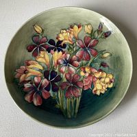 Front view of platter showing full floral design and green background.