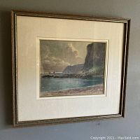 Full view of the framed oil pastel artwork depicting the cliff and seascape scene.