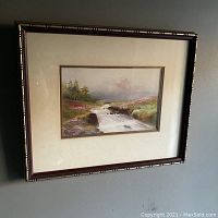 Framed original painting showing full artwork and frame on a wall.