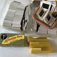 Overall lot: plastic tubs of slides, Arrow-View viewer box, yellow trays