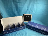 Box containing four Bohemia Crystal champagne saucer/sherbet glasses, unopened, showing original blue packaging with 'Claudia' branding.