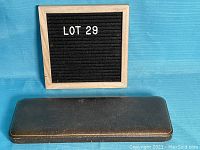 Closed rectangular vintage case housing the serving set