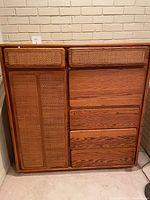 Front view of wooden credenza desk with four drawers on the right, two smaller drawers at the top, and a left cabinet with cane-front panels.