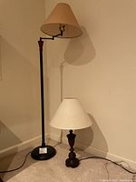 Photo showing floor lamp and table lamp unlit, highlighting lamp styles and size difference