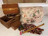 Overview of all items in the lot: the floral jewelry box, wicker baskets, wooden carved box, scarves, and wooden shoehorn.