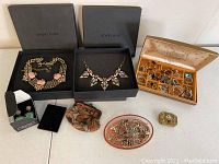 Full lot showing two Jewelmint boxes with necklaces, Adlair rings box, pink dish with silver jewelry, vintage change holder, and pill box.