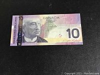 Front side of the 2008 Canadian ten dollar note showing Sir John A. Macdonald portrait and security features