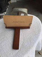 Wooden handheld stereoscope viewer showing maker information: Photographed and Published by B.W. Kilburn, Littleton, N.H.