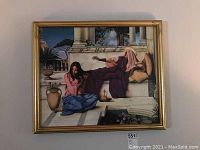 Full view of one framed art print depicting two figures in an outdoor setting with columns and plants.