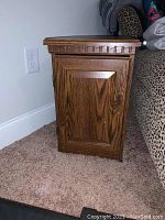 Side view showing the panel door with decorative trim and wood grain pattern.