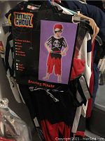 Photo of pirate children's costume with packaging showing outfit details and pieces included