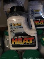 Front view of Prestone Driveway Concentrated Ice Melter container showing label and white pellets inside