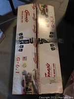 Box of Genesis Media Labs G-6.1 professional surround sound speakers, original packaging with product images and branding.