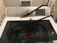 Top view showing glass lid and supply hoses