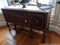 Front and top view showing marble top, drawers, and ornate brass hardware of walnut buffet server