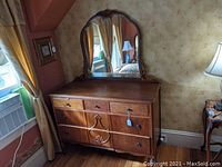 Front view of oak dresser with attached mirror showing overall design and condition