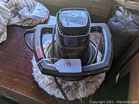 Top view of WEN orbital car buffer showing the main body, handle, control trigger, and attached 10-inch wool buffing pad.