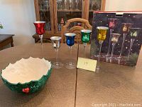Photo showing the ceramic bowl and all five colorful tall glass candle holders with their box in background