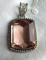 Front full view of the pendant showing the faceted pastel pink quartz set in a sterling silver bezel with bead accents.