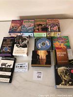 Overview photo showing all included audio books and boxed cassette sets spread out on table.