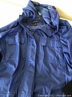 Blue Lands' End windbreaker jacket with zip front and hood, size large.