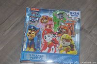 Front view of the PAW Patrol puzzle set box showing the 5 shaped puzzles featuring characters Chase, Marshall, Rubble, Skye, and Rocky