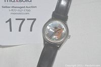 Front view of the Scooby Doo watch showing character graphic and leather band.