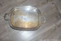Top view of the rectangular silver serving tray showing engraved surface and attached paper label '51'