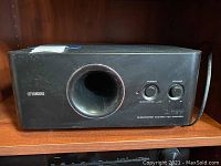Front view of Yamaha YST-FSW050 subwoofer on shelf