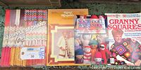 Lot of four yarn-craft pattern books and magazines, showing covers for 12 Ripple Afghans, Gypsy Mixables, Sock Doll Workshop, and Granny Squares & Needlework