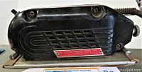 Side view of the black handheld sander showing the model plate with Weller Sander Model 700 metal tag.