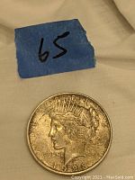 Obverse side of the 1923 D Peace Dollar coin showing Lady Liberty's profile with crown and inscriptions.