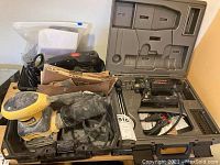 RotoZip Spiral Saw, DeWalt and Craftsman sanders in a case and grouped.