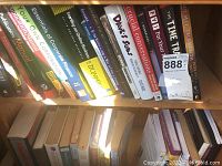 Shelf of business and self-help books including Essentials of Corporate Finance, Starting an Online Business For Dummies, and Your Own Corporation.