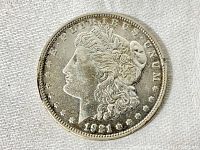 Obverse side of the 1921 Morgan dollar showing Lady Liberty's portrait with inscriptions and date.