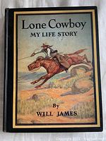 Front cover of Lone Cowboy My Life Story by Will James with a colorful cowboy and horse illustration.