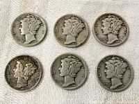 Obverse side of six Mercury dimes showing Liberty winged head design with dates 1941, 1942 (two coins), 1943, 1944, and one heavily worn with illegible date