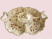 Top and angled view of the ornate porcelain sectional platter with gold floral decoration and two heart-shaped handles.
