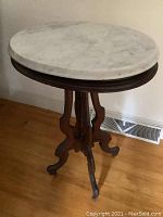 Full view of table showing marble top and wood base
