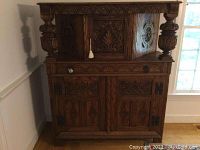 Front view of closed upper compartment and lower cabinet