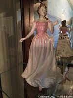 Front view of the Royal Doulton 'Margaret' HN4311 figurine showing the detailed pink and white gown, facial features, and posture.