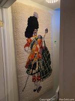 Full view of tapestry hanging in hallway showing entire figure and dimensions relative to doorway